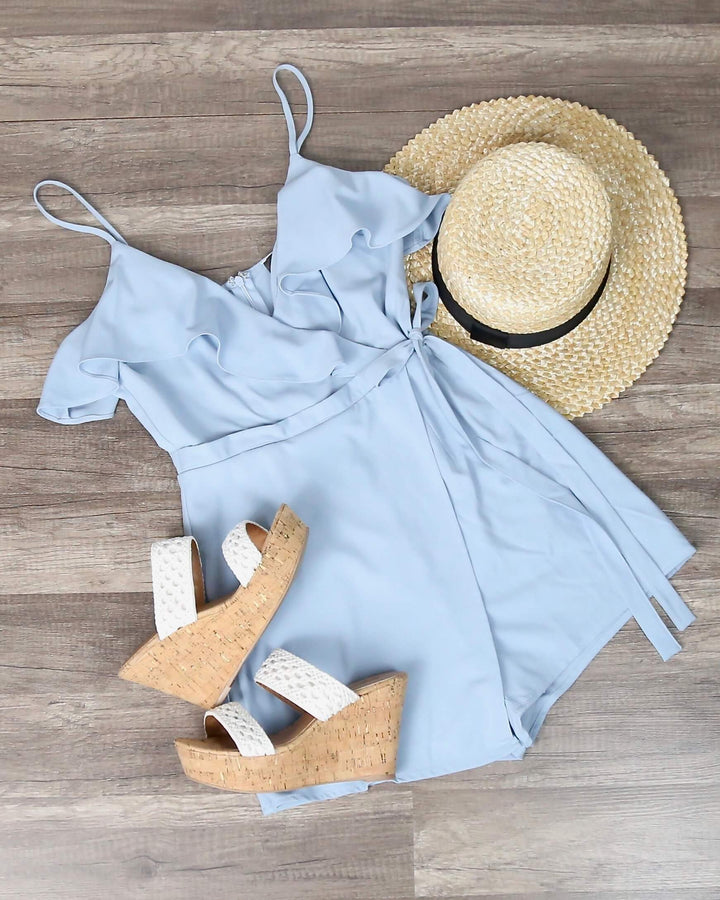 In My Feelings Ruffled Wrapped Sleeveless Romper in Sky Blue